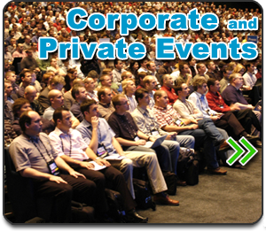 Private and Corporate shows button - photo of large audience seated in an auditorium